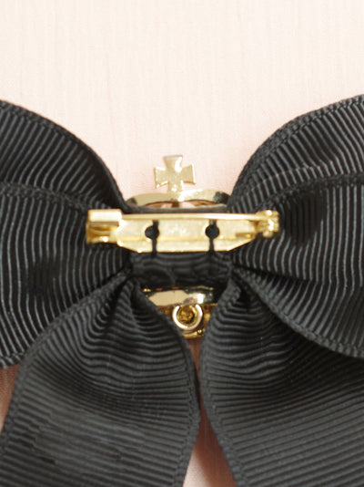 Ribbon brooch with crown charm