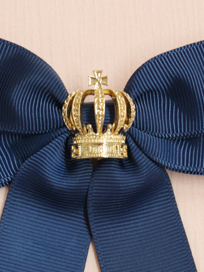 Ribbon brooch with crown charm