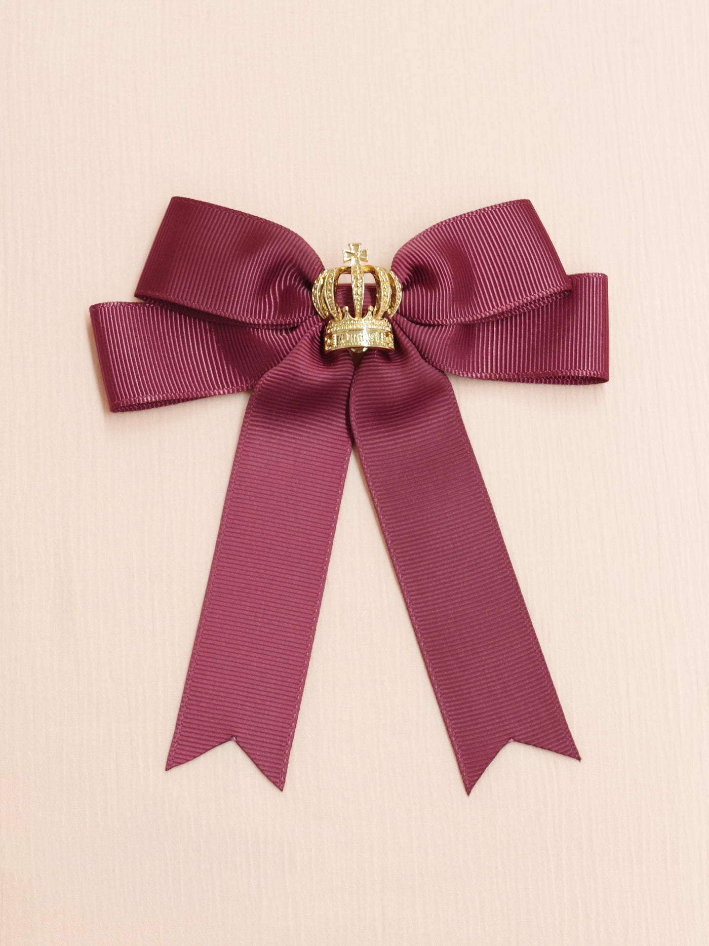 Ribbon brooch with crown charm