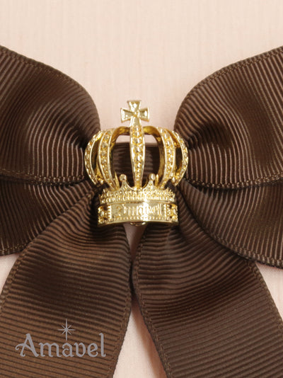 Ribbon brooch with crown charm