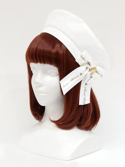 Beret with message ribbon brooch