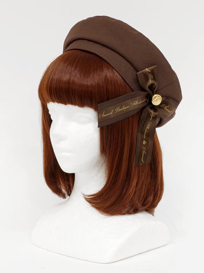 Beret with message ribbon brooch