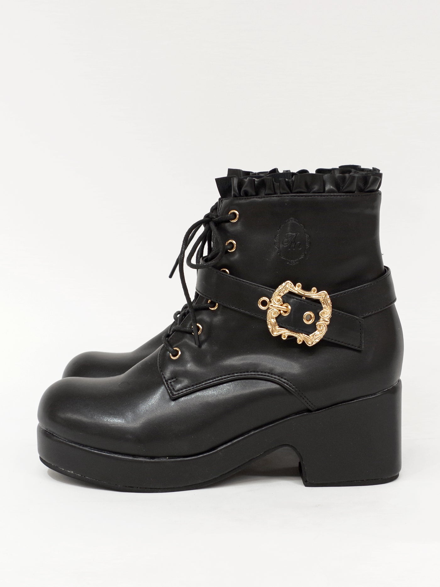 Monogram embossed frilled short boots