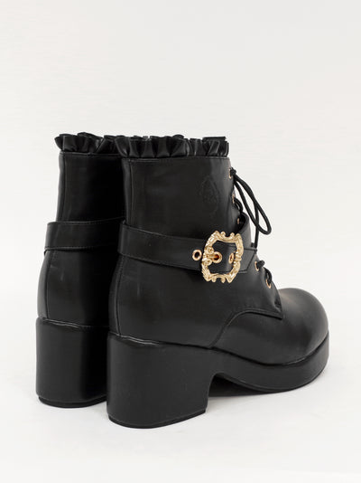 Monogram embossed frilled short boots