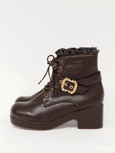 Monogram embossed frilled short boots