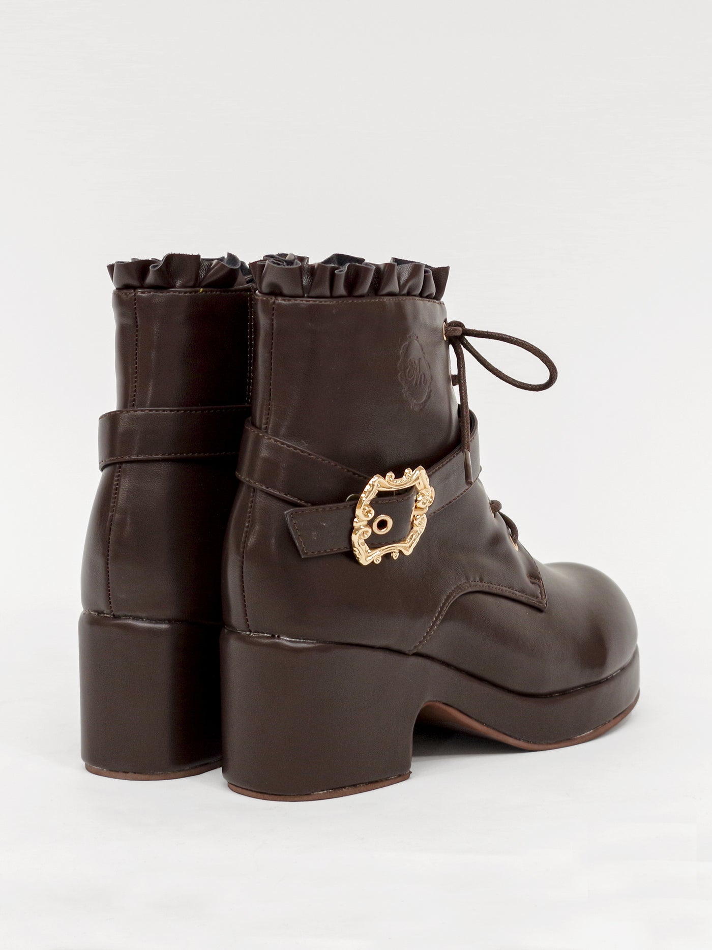 Monogram embossed frilled short boots