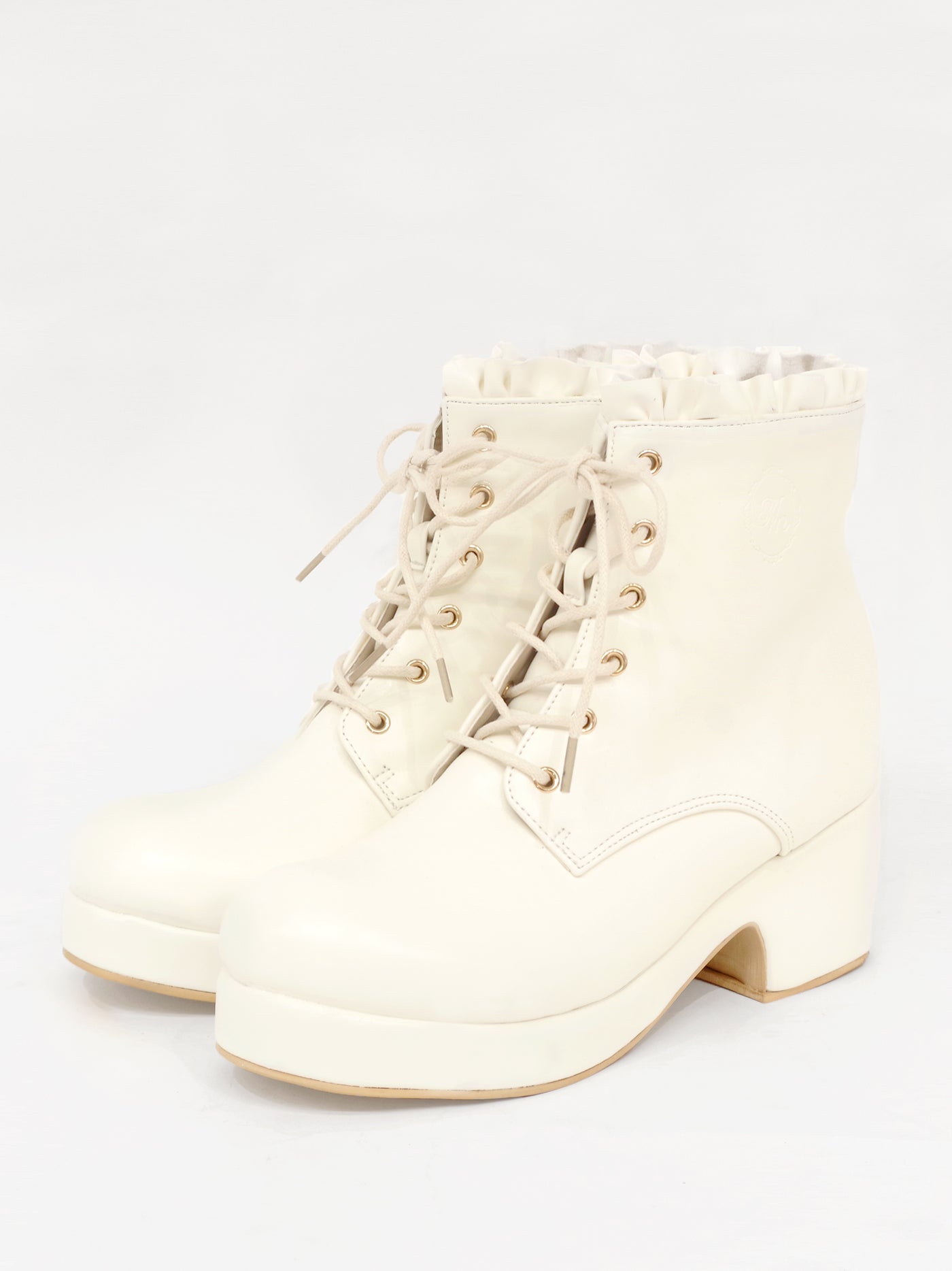 Monogram embossed frilled short boots